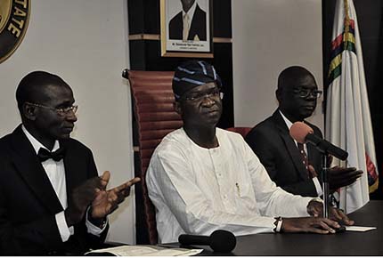 Lagos State Governor, Mr. Babatunde Fashola SAN (middle) and the Attorney-General and Commissioner for Justice, Mr. Ade Ipaye (right)